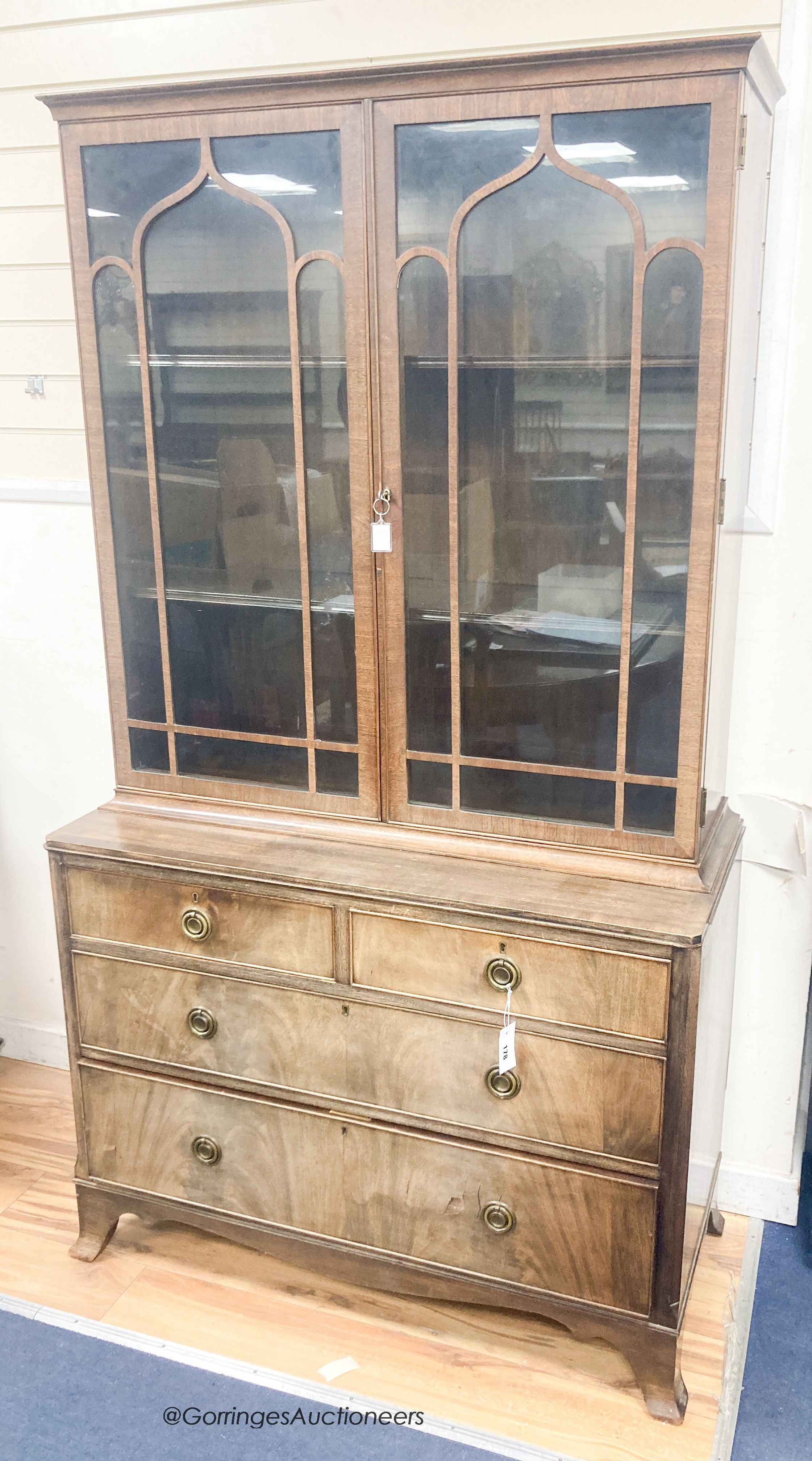 A George III style banded mahogany cabinet on chest, length 106cm, depth 48cm, height 191cm